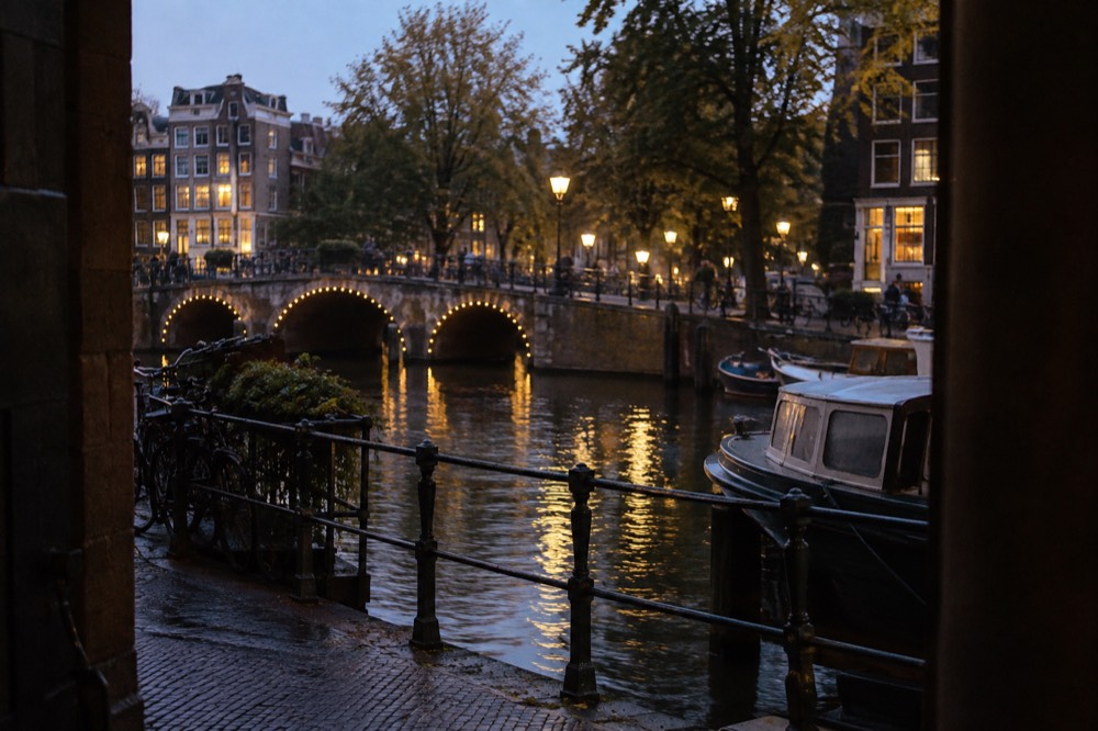 A canal bridge and moored boats close to Dam Square