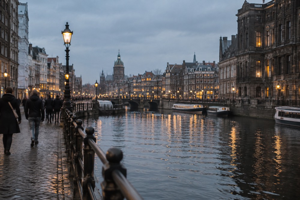 The waterfront near Dam Square under a broad grey northern sky