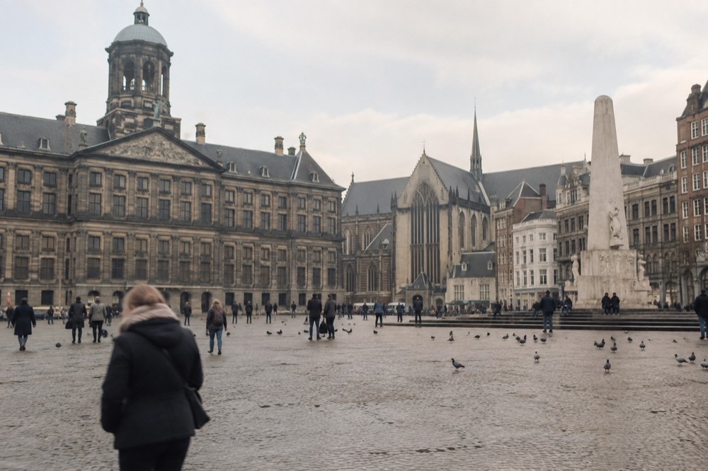 A street-level view of Dam Square on an ordinary weekday morning