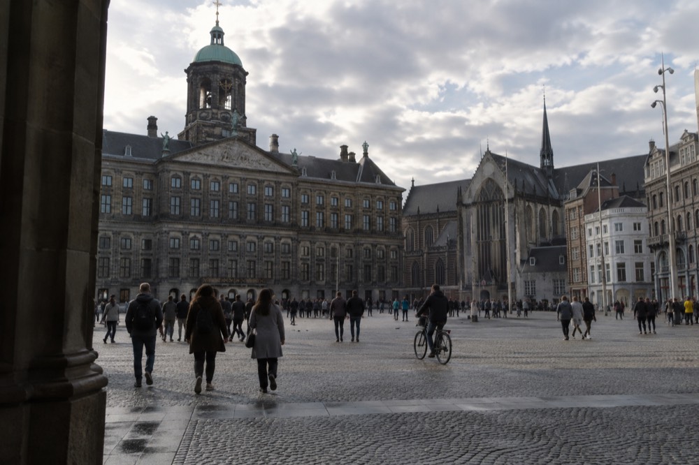 A street-level view of Dam Square on an ordinary weekday morning