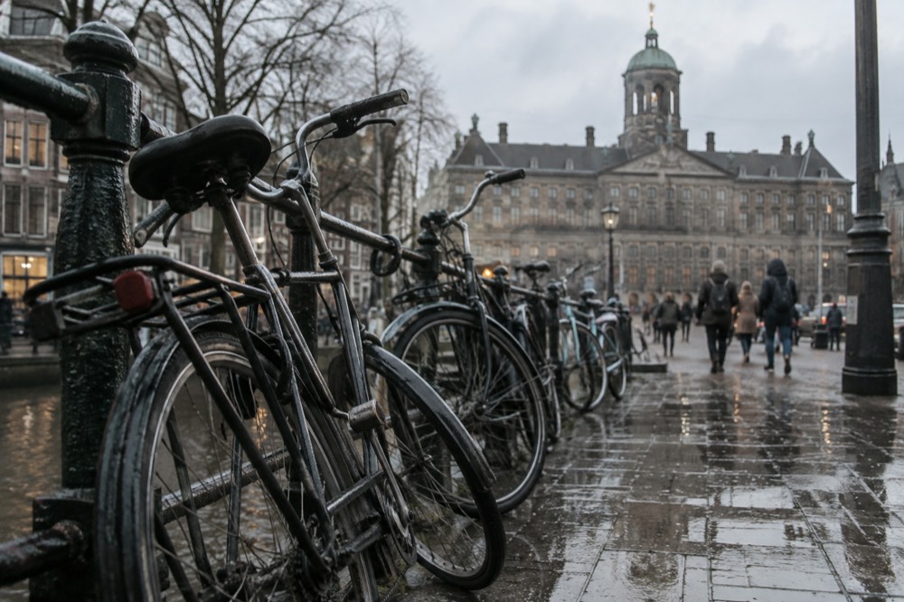 The approach to Dam Square, with bicycles leaning against the railings