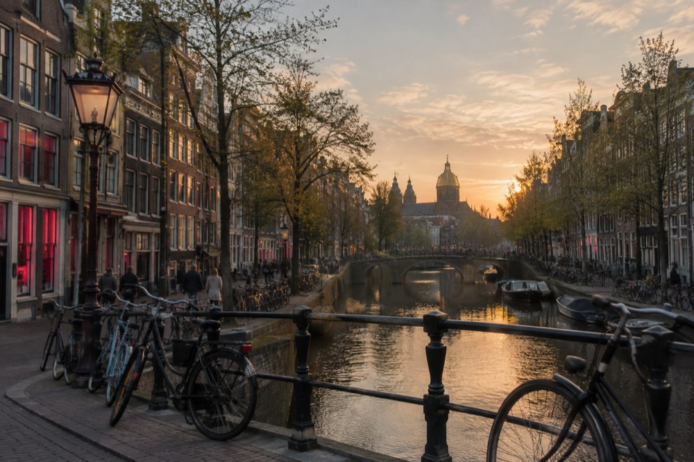The approach to Red Light District, with bicycles leaning against the railings
