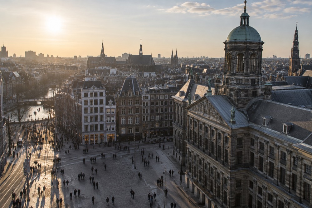 Low winter sun across the rooftops near Dam Square