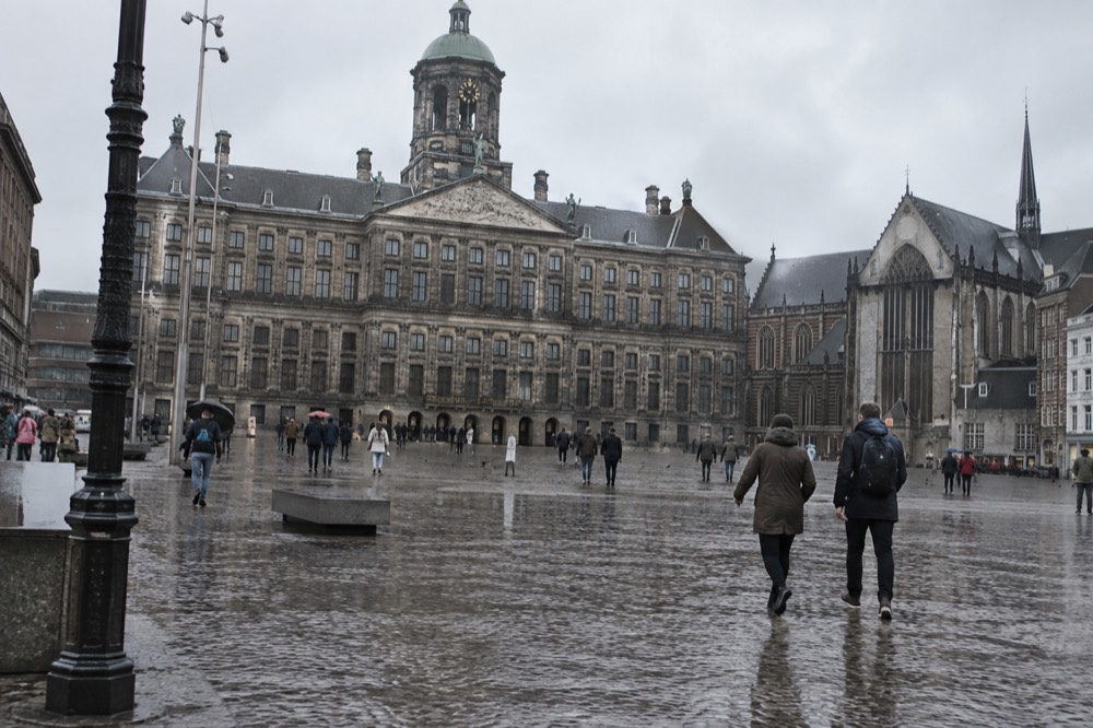 A street-level view of Dam Square on an ordinary weekday morning