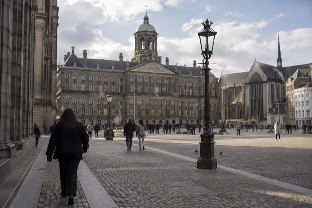 A street-level view of Dam Square on an ordinary weekday morning
