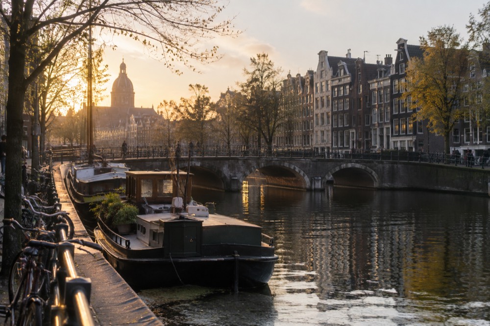 A canal bridge and moored boats close to Dam Square