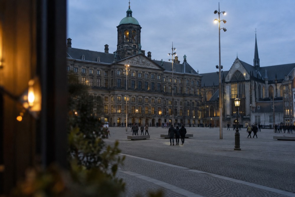 A street-level view of Dam Square on an ordinary weekday morning