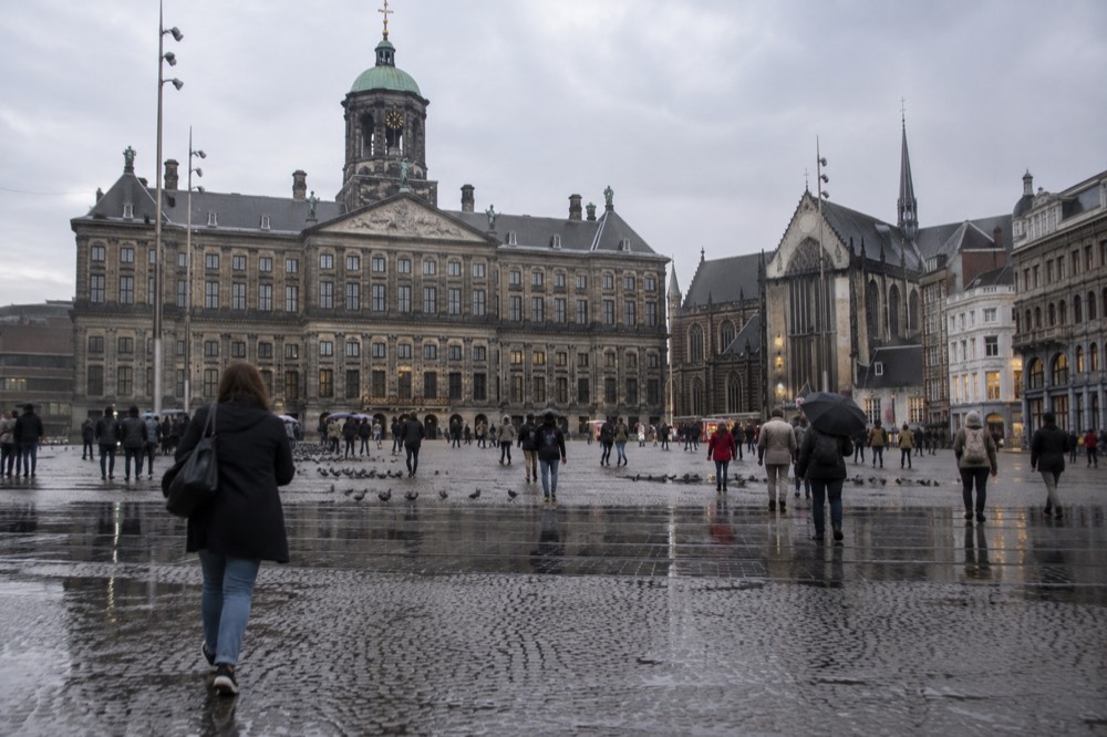 A street-level view of Dam Square on an ordinary weekday morning