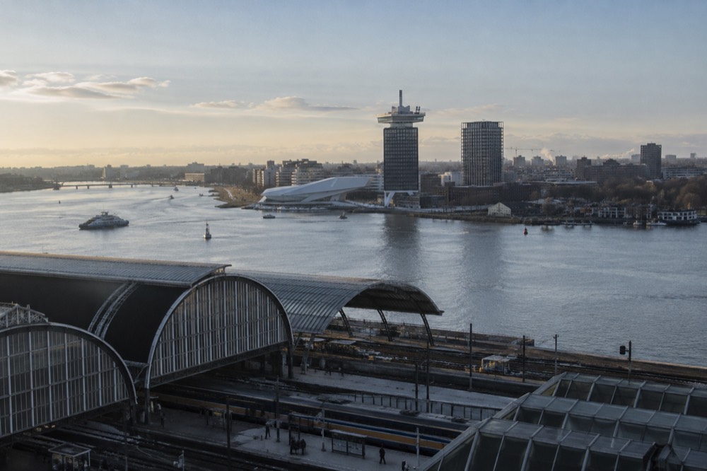 The A'DAM Lookout tower seen across the IJ water from behind Centraal Station