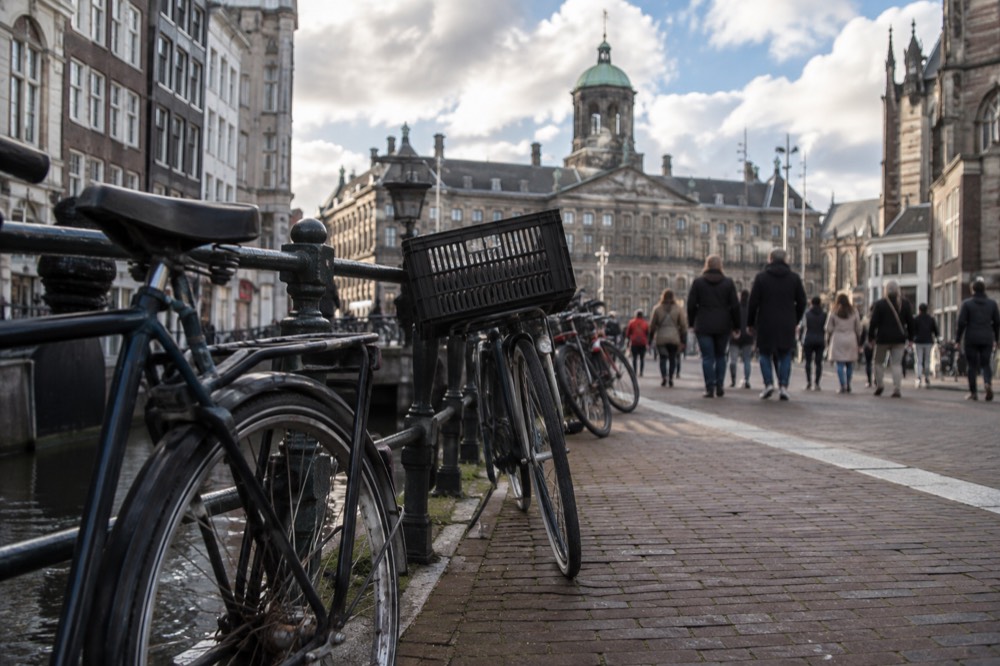 The approach to Dam Square, with bicycles leaning against the railings